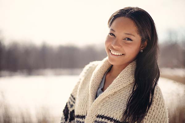 Girl walking around in a snow filled park